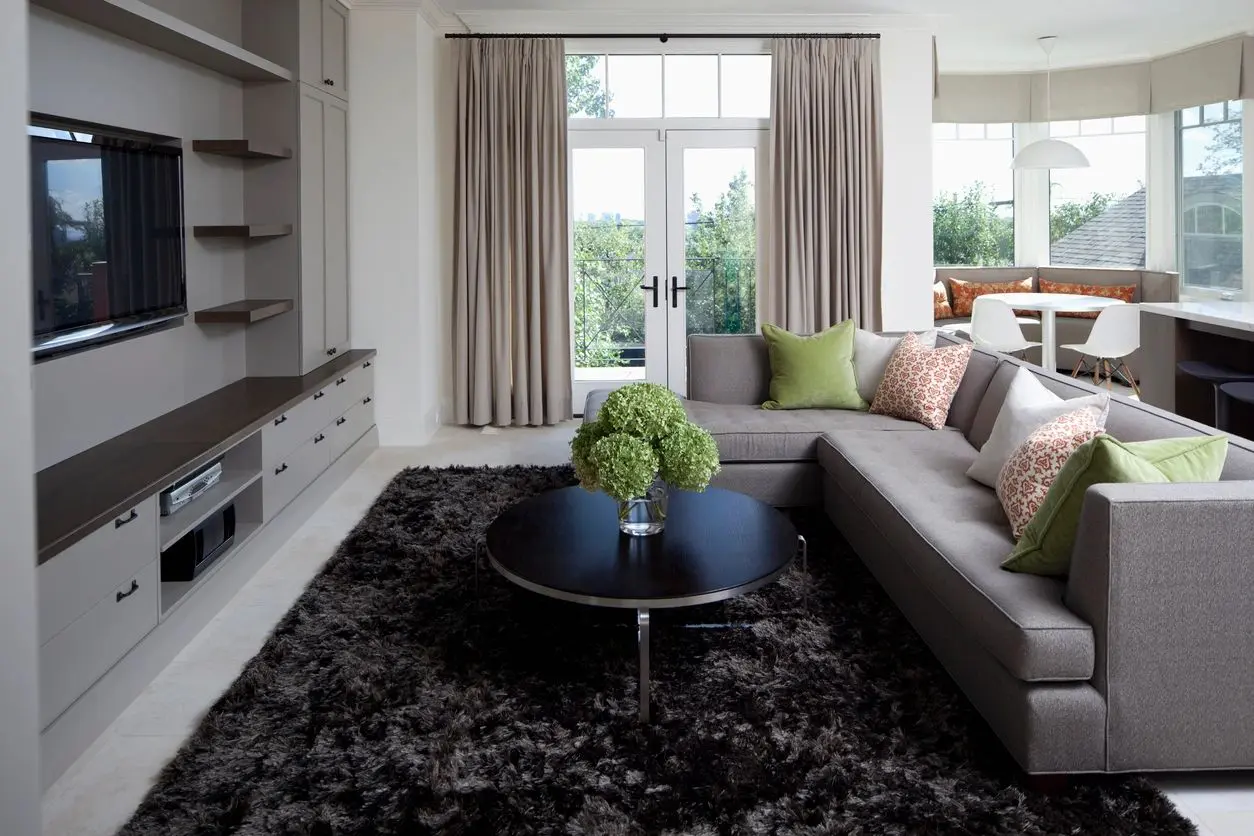 A living room with a couch and coffee table