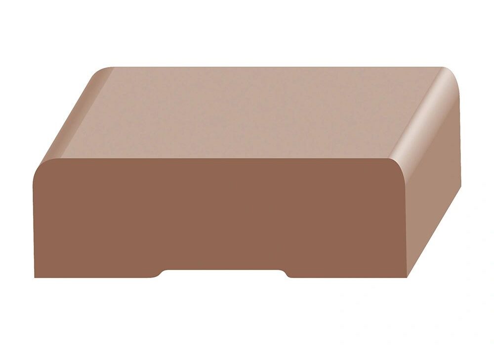 A brown block of clay is sitting on top of the floor.