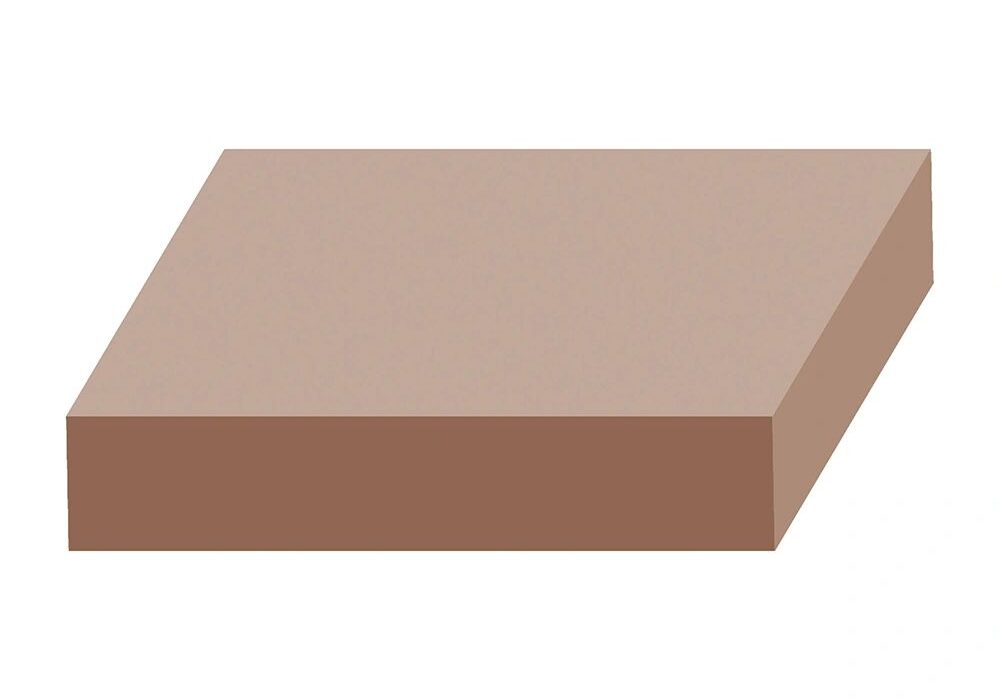 A brown square block sitting on top of a white table.